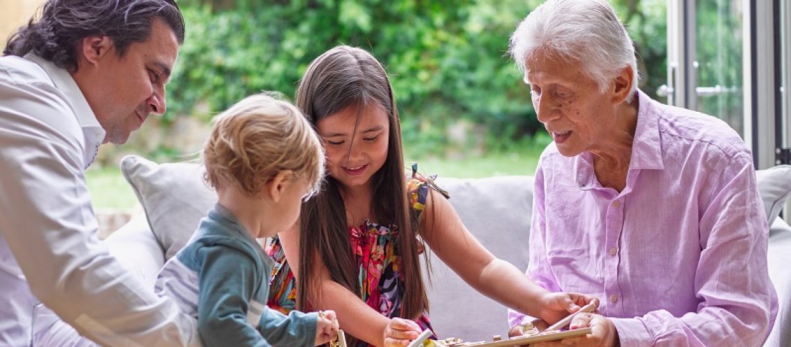 Multi generational family playing at home